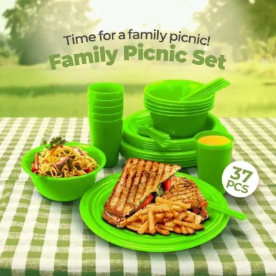 Green Saga Picnic Set 37 Pieces arranged on a green checkered tablecloth with sandwiches, fries, and noodle bowl.