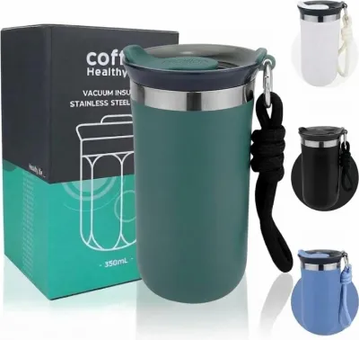 Green Vacuum Insulated Coffee Mug 350ml featuring a black carrying strap beside product box.